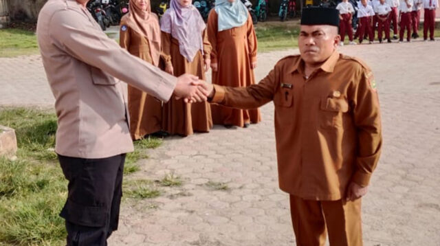 Bhabinkamtibmas Polres Subulussalam Jadi Pembina Upacara di SDN Kuta Gara